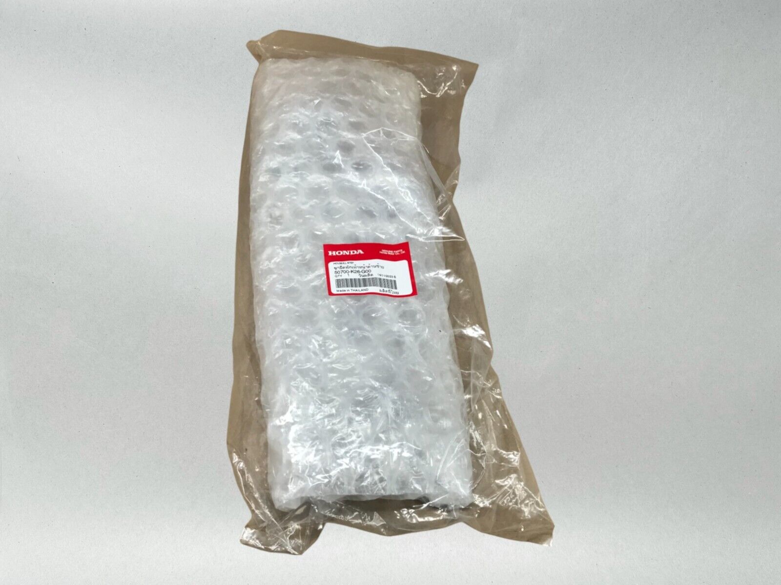 Honda OEM LEFT FOOTPEG BRACKET 22-24 GROM 125 50700-K26-G00