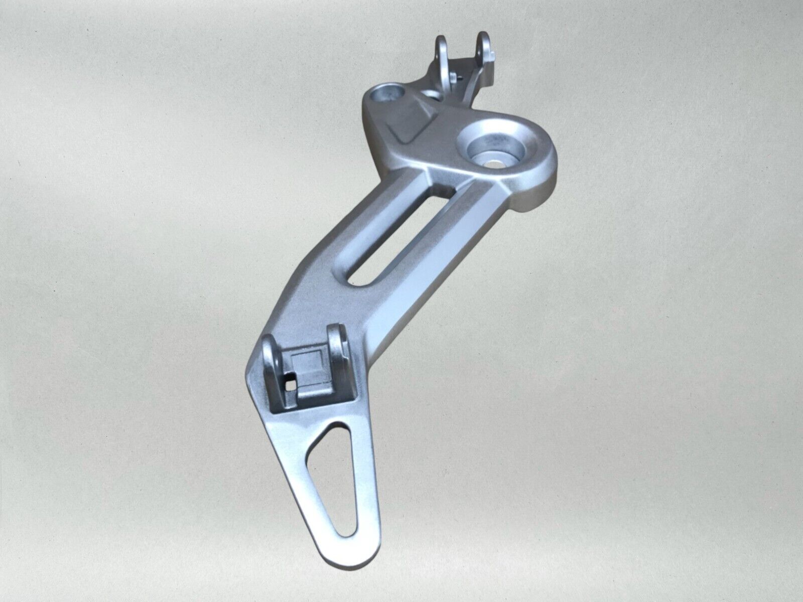 Honda OEM LEFT FOOTPEG BRACKET 22-24 GROM 125  50700-K26-G00