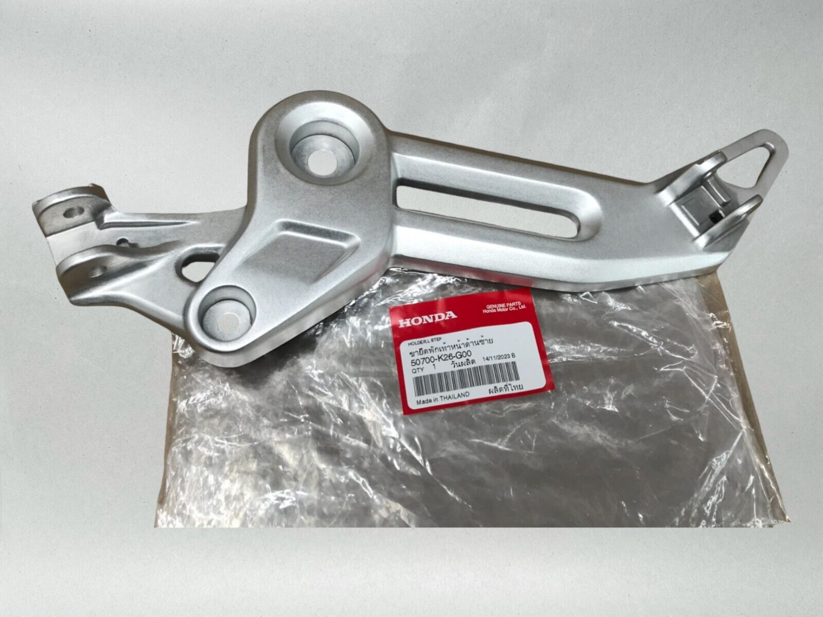 Honda OEM LEFT FOOTPEG BRACKET 22-24 GROM 125  50700-K26-G00